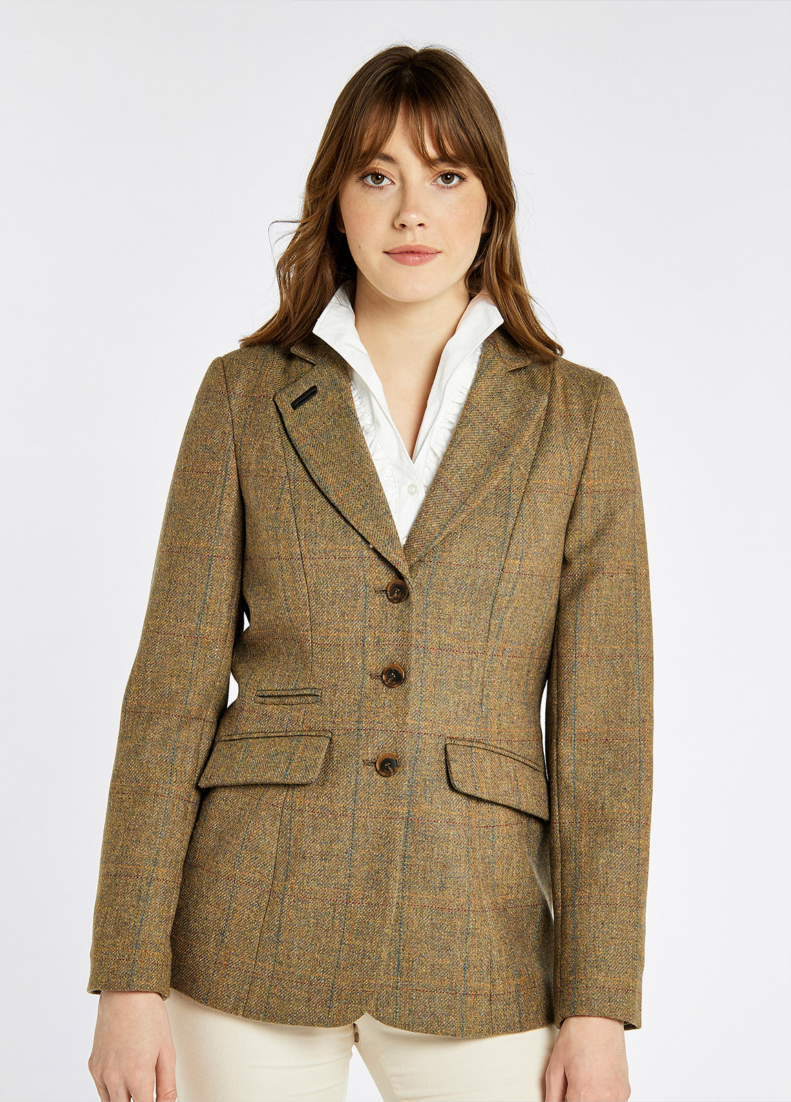 A woman modelling Dubarry women's Darkhedge Tweed Burren Jacket with stripe sleeve lining, buttons and single back vent.